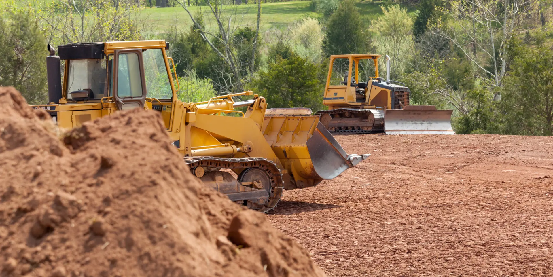 Bulldozers clearing the land dirt